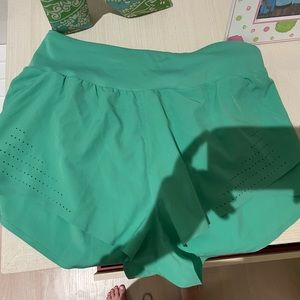 Green athletic shorts